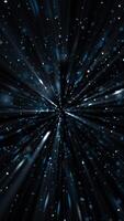 Vertical video - glittering blue particles and shimmering light beams motion background animation. This abstract background is full HD and a seamless loop.