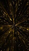 Vertical video - sparkling gold particles and shimmering light rays motion background animation. This glitzy, golden background is full HD and looping.