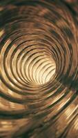 Vertical video - flying through an empty shiny metallic tunnel of golden rings endlessly rotating. Full HD and looping gold colored motion background animation.