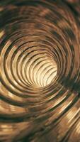 Vertical video - flying through an empty shiny metallic tunnel of golden rings endlessly rotating. Full HD and looping gold colored motion background animation.