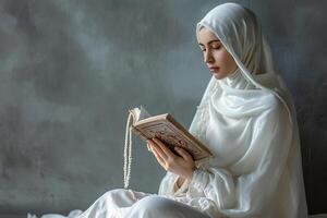 AI generated muslim woman praying with quran with generative ai photo