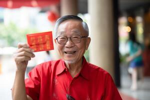 AI generated chinese grandpa wearing traditional suit and holding aungpao bokeh style background with generative ai photo