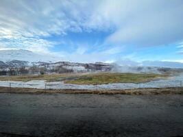 A view of the Iceland Countryside in the winter covered with Snow near the Gulfos Waterfall photo