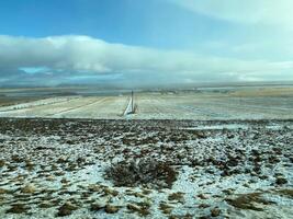 A view of the Iceland Countryside in the winter covered with Snow near the Gulfos Waterfall photo