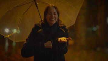 Happy Carefree Woman Dancing With Umbrella Outside in Rainy Night video