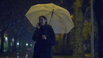 Unhappy Worried Female Person Crying While Calling Holding Umbrella video