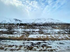 A view of the Iceland Countryside in the winter covered with Snow near the Gulfos Waterfall photo