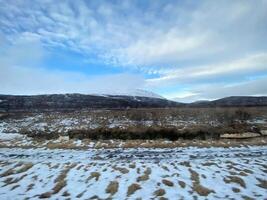 A view of the Iceland Countryside in the winter covered with Snow near the Gulfos Waterfall photo