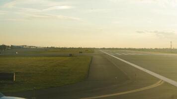 The airport view with the empty run way and sunset sunlight as background photo