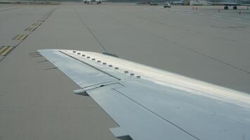 The airplane wing view looked from the flying plane window with the sunset sunlight on it photo