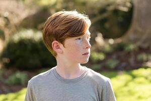 AI generated Close up portrait of a thoughtful boy. AI generated photo