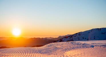 Freshly groomed ski slope photo