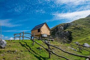 Wooden house with opening roof photo