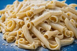 AI generated Alfredo Pasta on Blue Background photo