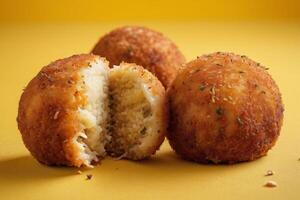 AI generated Arancini on Yellow Background photo