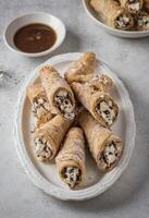 AI generated Sicilian Dessert Cannoli on a Plate photo