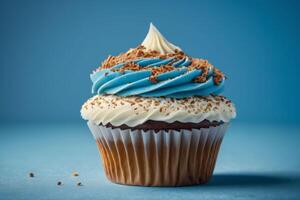 AI generated Blue and White Iced Cupcake on Blue Background photo