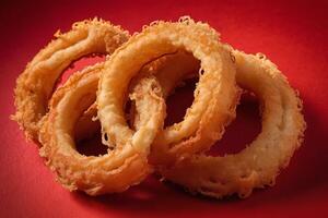 AI generated Deep Fried Onion Rings on Red Background photo