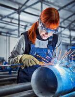 AI generated Female welder on her working place, welding tube with sparks photo