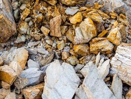 Texture of stone and soil on rocky mountain soil photo