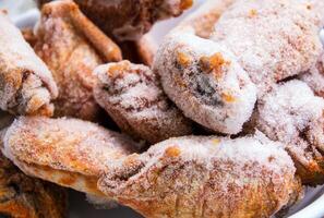 Some pieces of frozen chicken wings photo