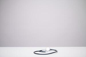 The stethoscope, against a white background, symbolizes the essence of healthcare, a universal emblem representing the commitment to medical care and well-being. photo