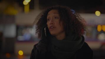 Stressed Woman Talking Worried on Smartphone in the City at Night video