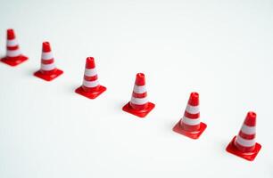 Road cones in a row. Barrier, fencing. Safety and red lines, red flags. photo