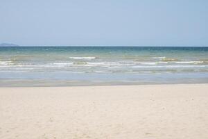 Beautiful beach with white sand and blue and clear sky background photo