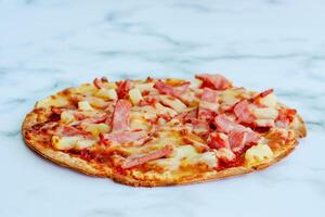 Delicious pizza on white marble background photo