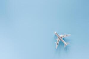 White airplane model on blue background photo