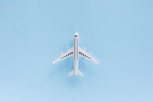 White airplane model on blue background photo