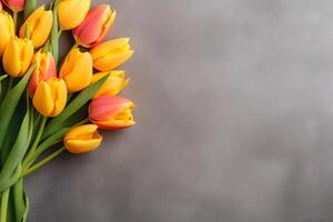 AI generated Colorful tulip flowers on dark concrete background, spring flat lay composition. Valentine's, womens, mothers day, birthday or wedding concept. Top view. Copy space. Generated AI. photo