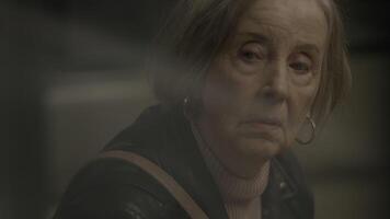 Worried Grandmother Commuting Alone in Trainstation Feeling Stressed video