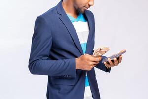 close up of a financial accountant isolated over white background calculating with a calculator photo