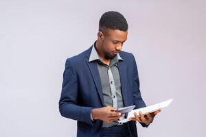 man feeling happy as he is calculating his invoice photo