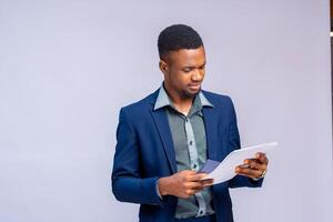 man calculating the invoice of his company photo