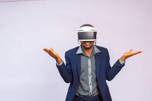 Immersed man looking up in virtual reality while wearing portable VR photo