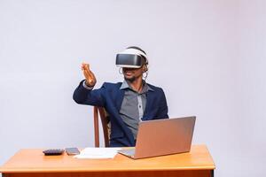 designer is testing a virtual reality helmet in the new office photo