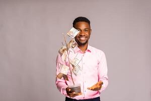 african man holding money growth plant ,save money photo