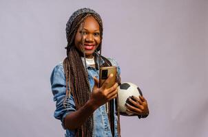 Young lady making sport bets online using mobile application. photo