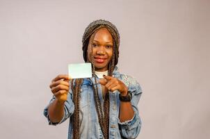 beautiful lady pointing to the identity card on her hand photo