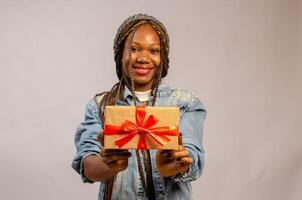 lady holding gift, package, box and present on her smiling photo