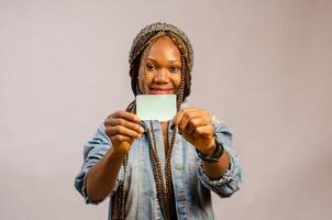 lady holing her identity card on her hand smiling photo