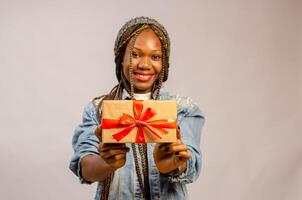 lady holding gift, package, box and present on her smiling photo