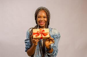 lady holding gift, package, box and present on her smiling photo