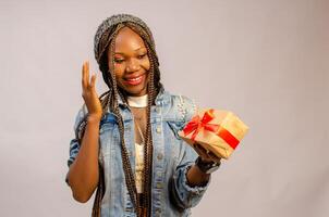 excited lady looking at the present on her hand photo