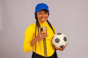 Young lady making sport bets online using mobile application. photo