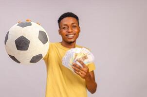 african guy isolated over white background pointing his ball forward photo