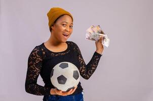 excited lady holding a football isolated over white background excited photo